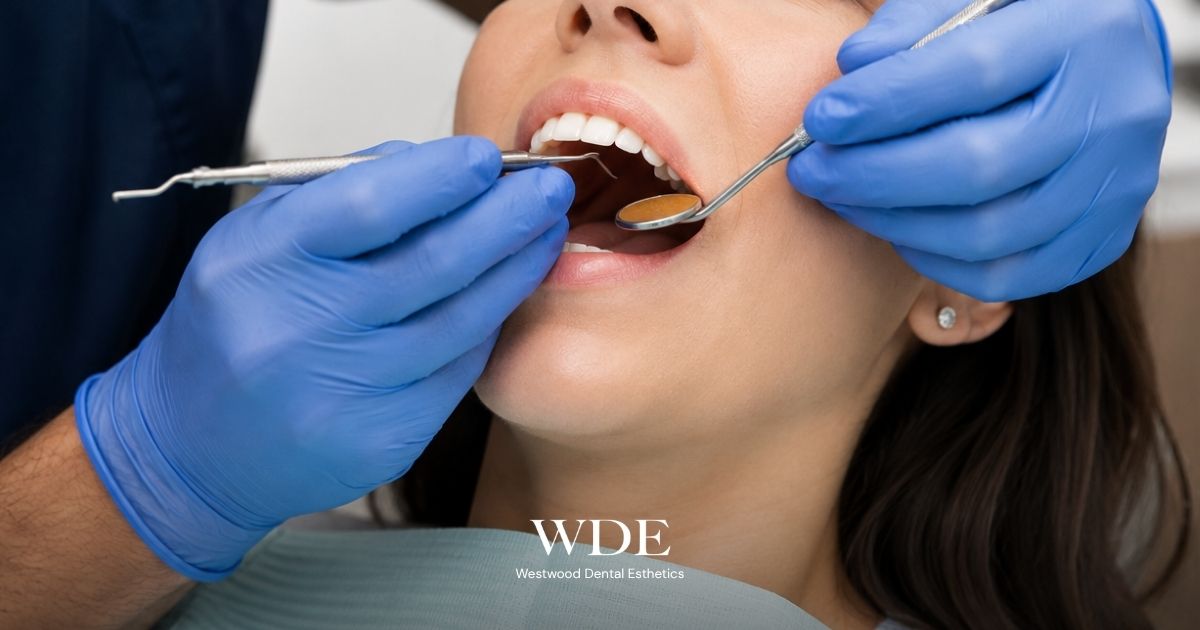Dentist performing a clinical dental examination before root canal treatment to evaluate the tooth and determine the appropriate treatment plan.