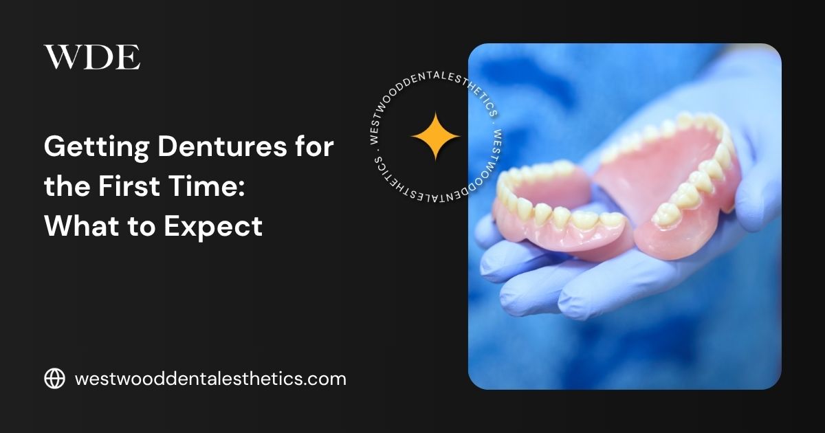 Dentures being held by a dental professional, illustrating the process of getting dentures for the first time and understanding removable tooth replacement options.
