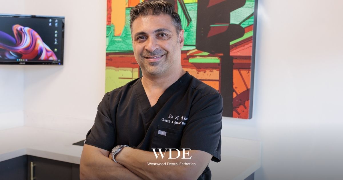  Dr. Kaivan Kiai standing in a dental office, representing personalized Invisalign consultations and candidacy evaluations for West Los Angeles patients.