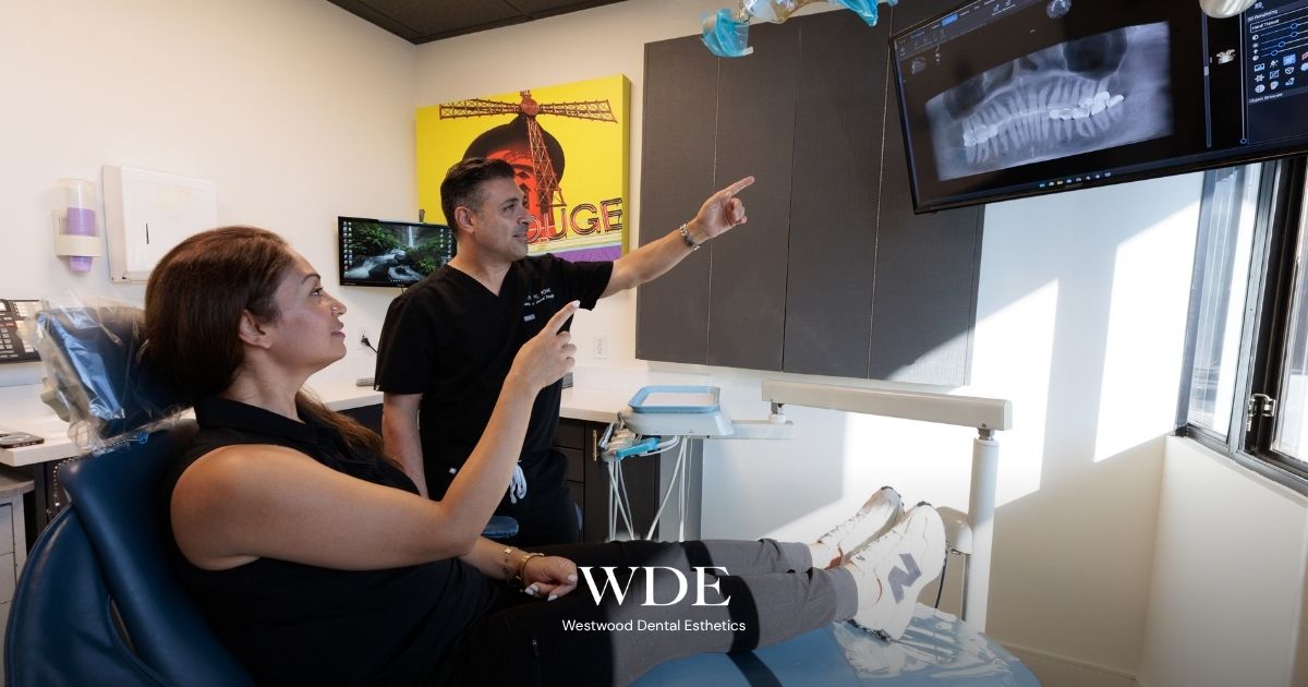 Inlays and Onlays vs. Traditional Fillings: When Does a Cavity Need a Partial Crown? 3 Dr. Kaivan Kiai reviewing a patient’s dental X-ray during an examination at Westwood Dental Esthetics.