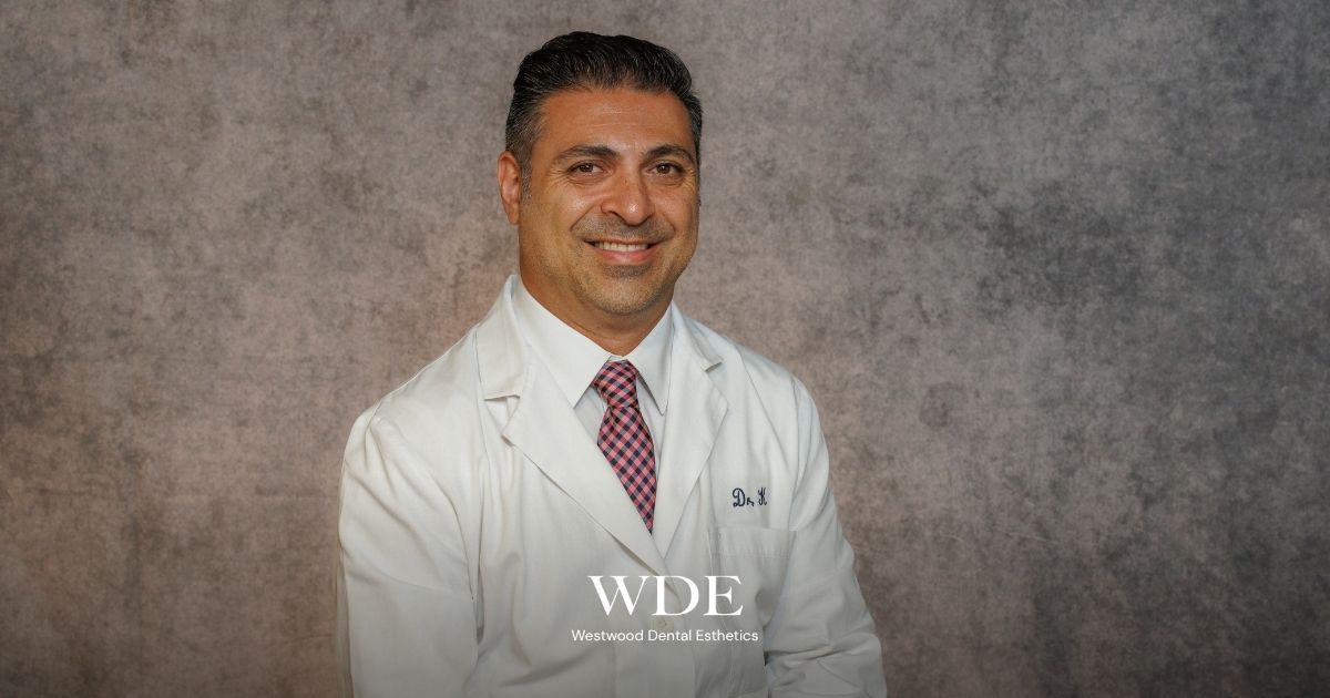 Dr. Kiai at Westwood Dental Esthetics providing guidance for patients adapting to dentures.
